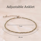 VASTUKOSHA adjustable pyrite beaded anklet with metallic gold finish, shown with 7cm and 25cm measurement indicators.