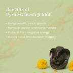 VASTUKOSHA Pyrite Ganesha idol on a light green background with yellow marigold flowers for spiritual decor
