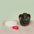 VASTUKOSHA Pyrite Ganesha idol with a raw white Selenite charging plate for spiritual decor and Vastu practices.