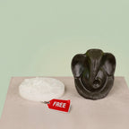 VASTUKOSHA Pyrite Ganesha idol with a raw white Selenite charging plate for spiritual decor and Vastu practices.