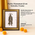 VASTUKOSHA Pyrite Hanuman Ji figurine mounted on a white Selenite frame with an ornate gold border for spiritual decor.