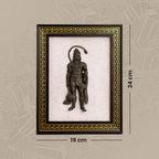 VASTUKOSHA Pyrite Hanuman Ji idol mounted on a white Selenite crystal frame with an ornate gold and dark wood border.