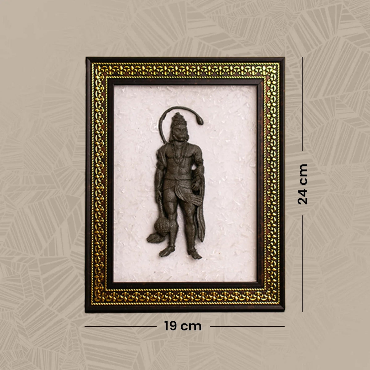 VASTUKOSHA Pyrite Hanuman Ji idol mounted on a white Selenite crystal frame with an ornate gold and dark wood border.