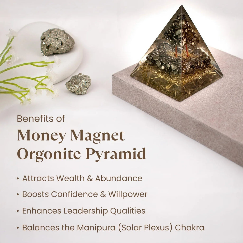 VASTUKOSHA Money Magnet Pyrite Orgonite Pyramid on a desk, featuring metallic crystal shards in clear resin.