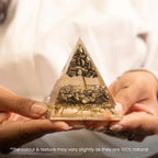 VASTUKOSHA Pyrite orgonite pyramid with metallic crystal chips and tree design held in hands for prosperity decor.
