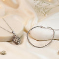 VASTUKOSHA Princess Combo featuring a raw capped pyrite pendant and a delicate pyrite bead anklet on a silk background.