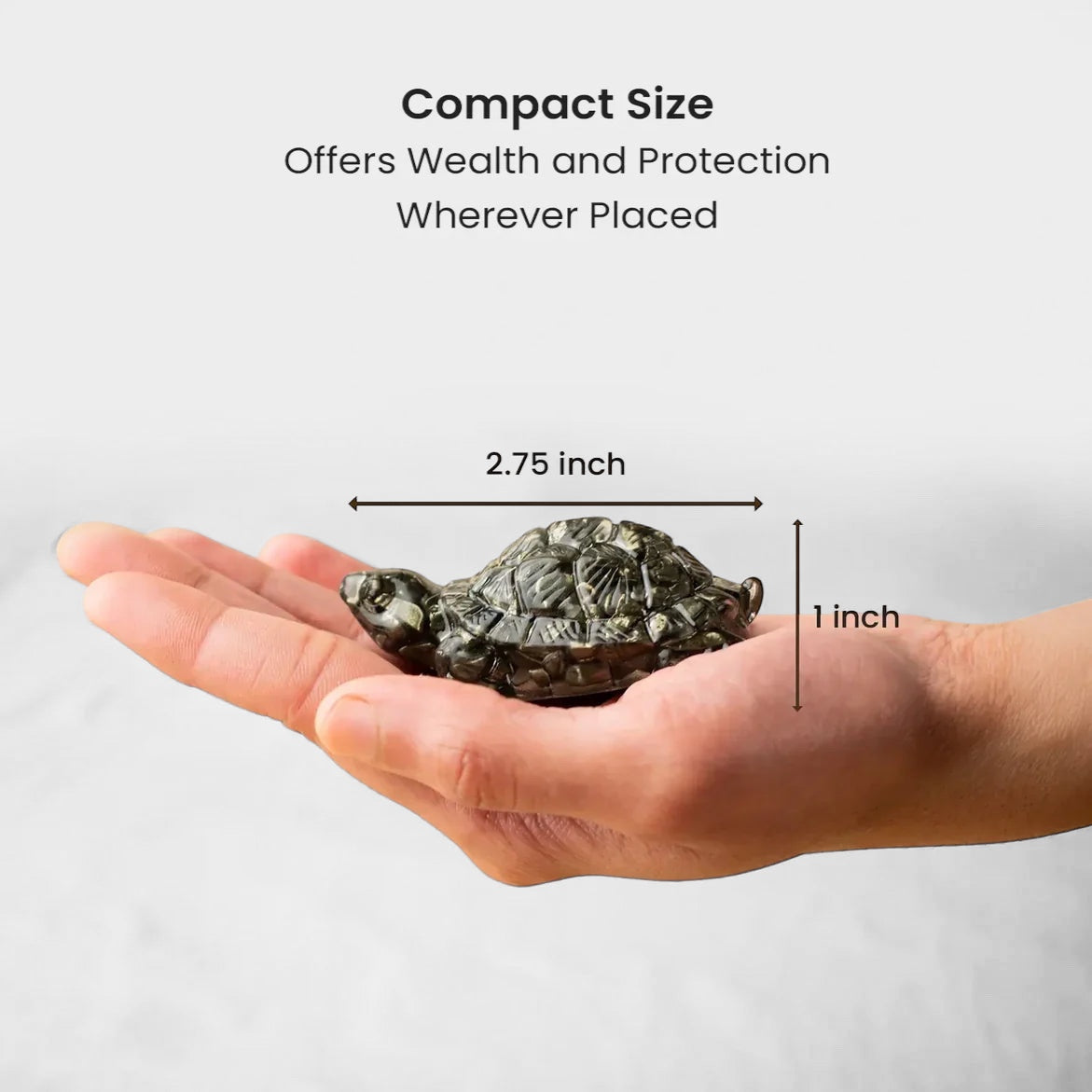 VASTUKOSHA Maha Ashtlakshmi Siddh Pyrite tortoise held in a palm, showing compact size for wealth and protection.