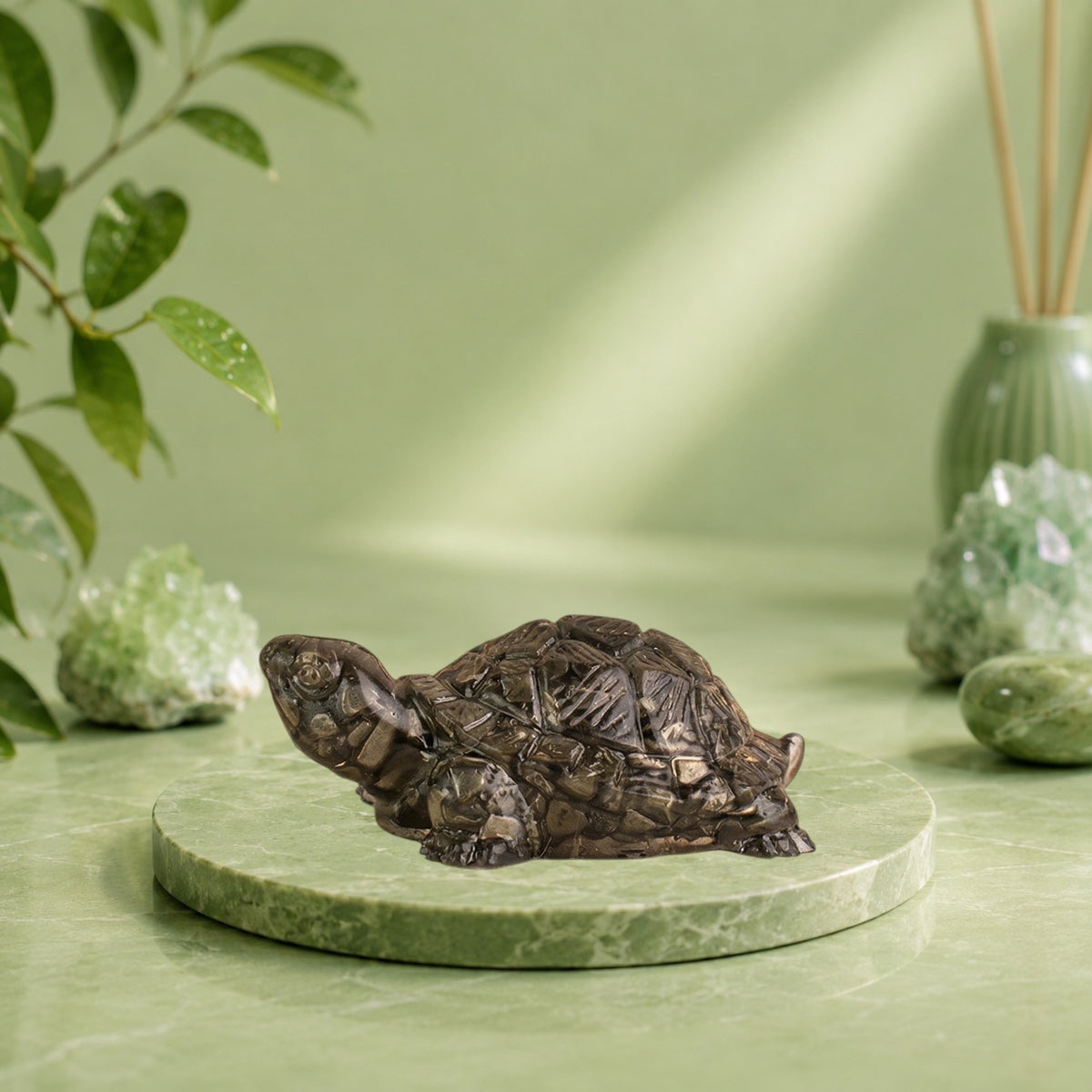 VASTUKOSHA Rinmukteshwar Siddh pyrite tortoise figurine for Vastu, wealth, and debt relief on a cloth with diya