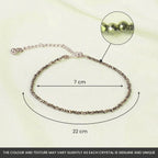 VASTUKOSHA Rishikesh Siddh raw pyrite anklet with faceted metallic beads on a white fabric background