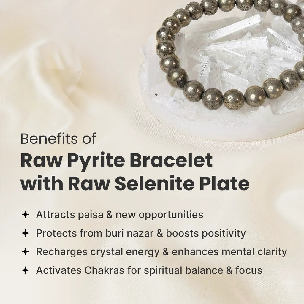 VASTUKOSHA raw pyrite bead bracelet resting on a white selenite charging plate on a soft fabric background