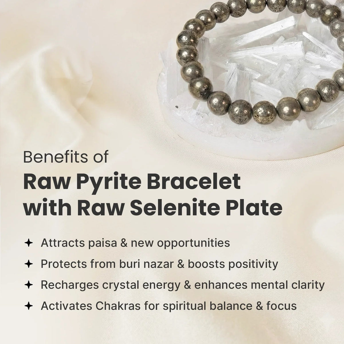 VASTUKOSHA raw pyrite bead bracelet resting on a white selenite charging plate on a soft fabric background