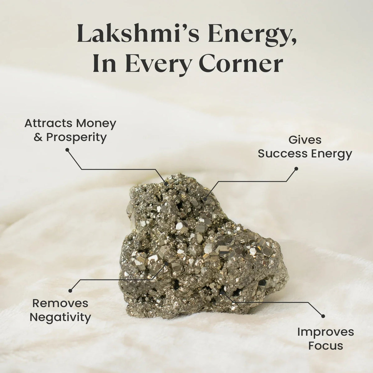 VASTUKOSHA raw pyrite stone with metallic luster and crystalline texture on a soft white fabric background