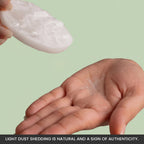 VASTUKOSHA raw selenite charging plate showing natural mineral dust shedding on a hand for authenticity
