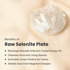 VASTUKOSHA raw selenite plate for crystal cleansing and recharging on a soft beige fabric background