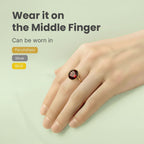 VASTUKOSHA natural deep red garnet gemstone ring worn on a finger, suitable for gold, silver, or panchdhatu settings.