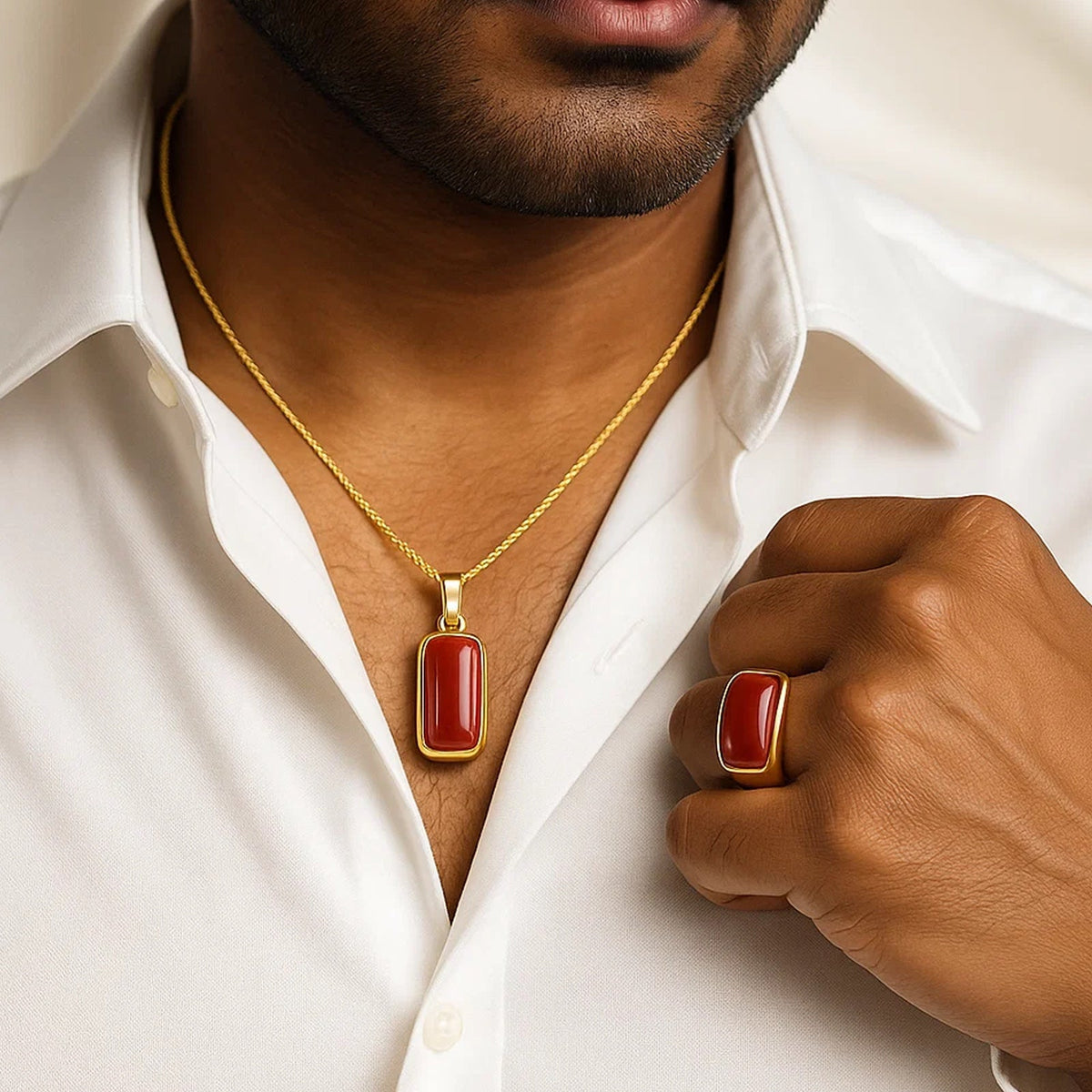 VASTUKOSHA natural red Moonga gemstone pendant and matching ring set worn by a man in a white shirt