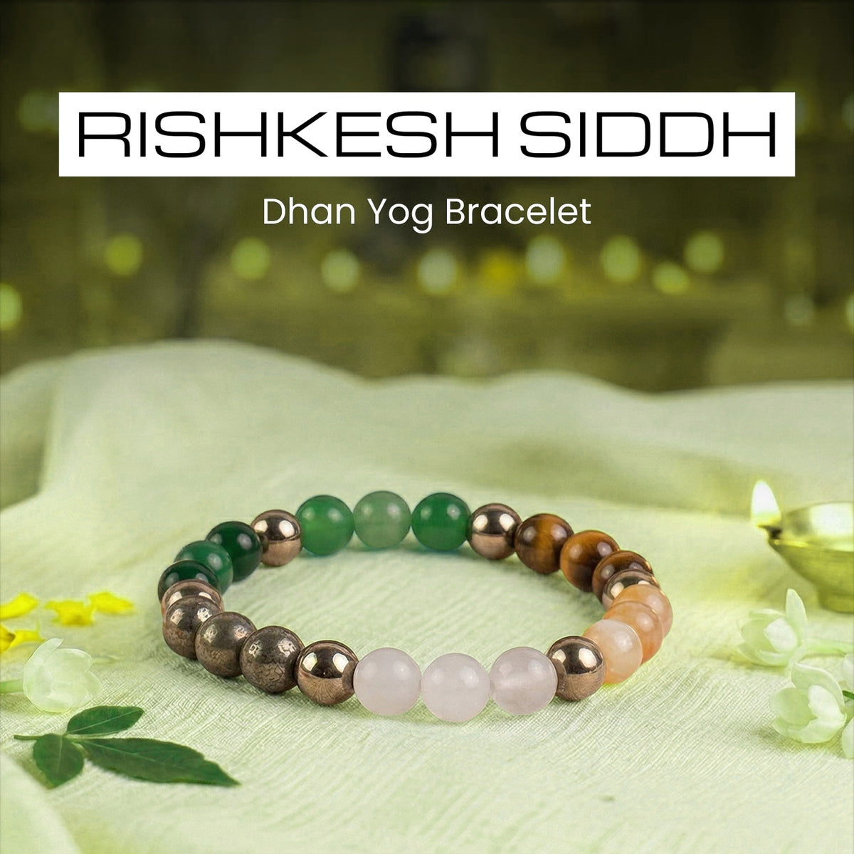 VASTUKOSHA Rishikesh Siddh Dhan Yog crystal bracelet featuring green, brown, and pink beads on a light fabric surface.