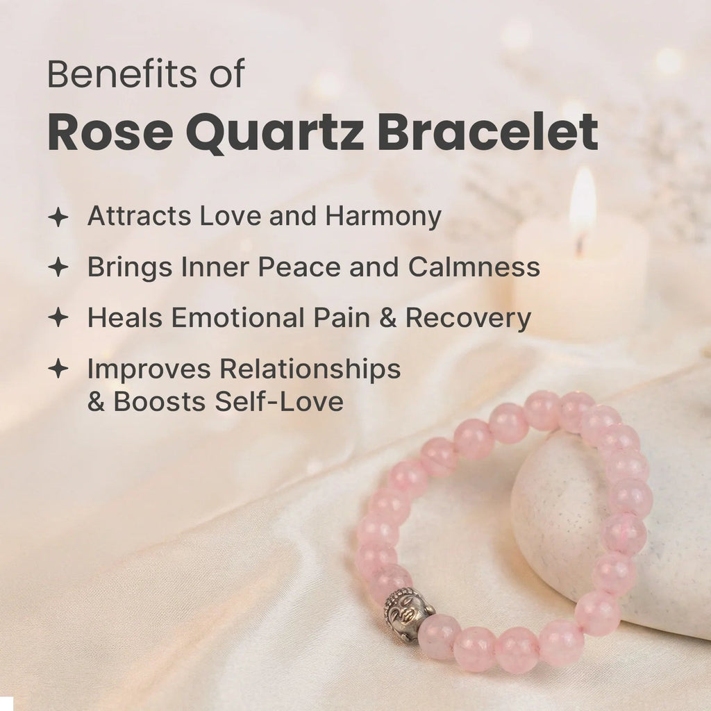 VASTUKOSHA rose quartz beaded bracelet with a silver Buddha charm on a soft white fabric background with a candle