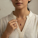 VASTUKOSHA ruby gemstone pendant and matching ring set worn by a woman in a white embroidered kurta