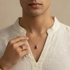 VASTUKOSHA ruby gemstone pendant and matching ring set worn by a man in a white embroidered kurta