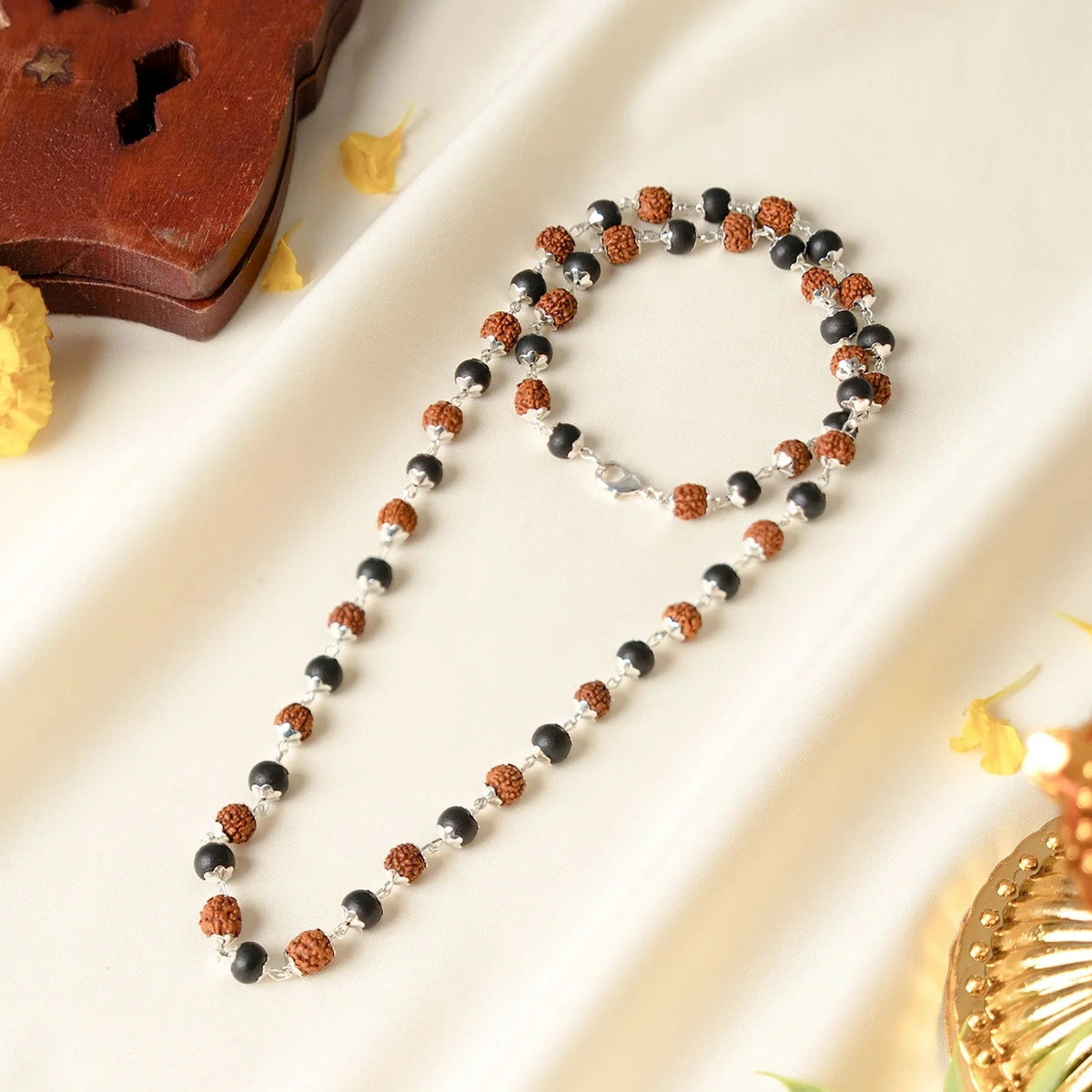VASTUKOSHA Divya Raksha Mala featuring 5 Mukhi Rudraksha and black Karungali beads with oxidised silver-plated caps.