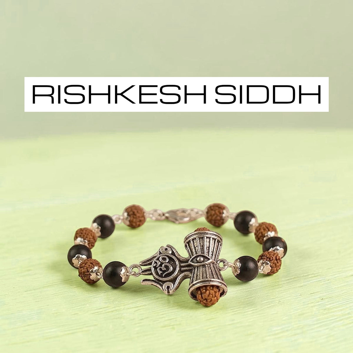 VASTUKOSHA Rishikesh Siddh bracelet featuring Rudraksha and Karungali beads with a silver Om, Trishul, and Damru charm.