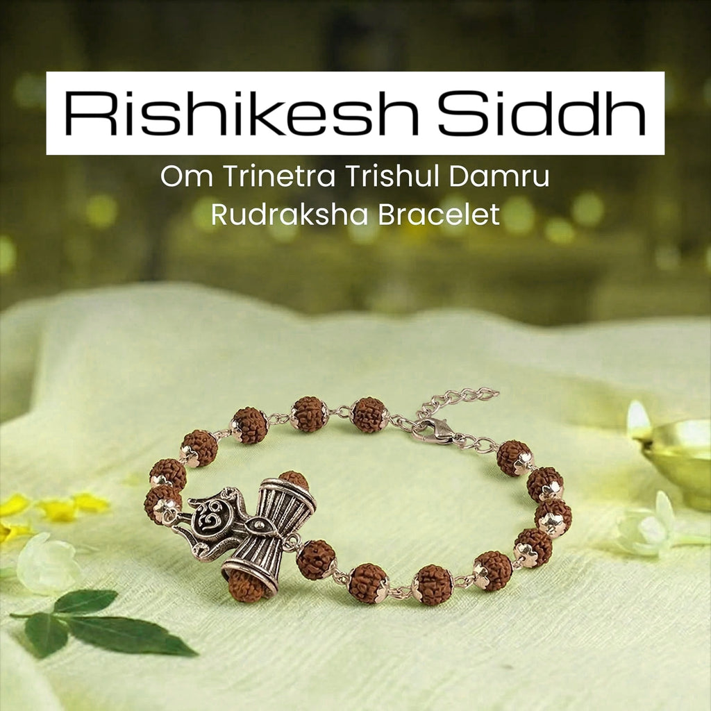 VASTUKOSHA Rishikesh Siddh Rudraksha bracelet featuring silver Om, Trishul, and Damru charms on a soft green fabric.