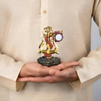 VASTUKOSHA Shiva Shakti Trishul murti with Om, Damru, and Rudraksha beads held in hands, gold finish devotional decor.