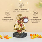 VASTUKOSHA Shiva Shakti Trishul murti featuring a golden trident, Om symbol, damru, and rudraksha beads on a dark base.
