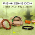 VASTUKOSHA Siddh Maha Dhan Yog combo featuring a 5 Mukhi Rudraksha bracelet, a Dhan Yog crystal bracelet, and an obsidian evil eye bracelet.
