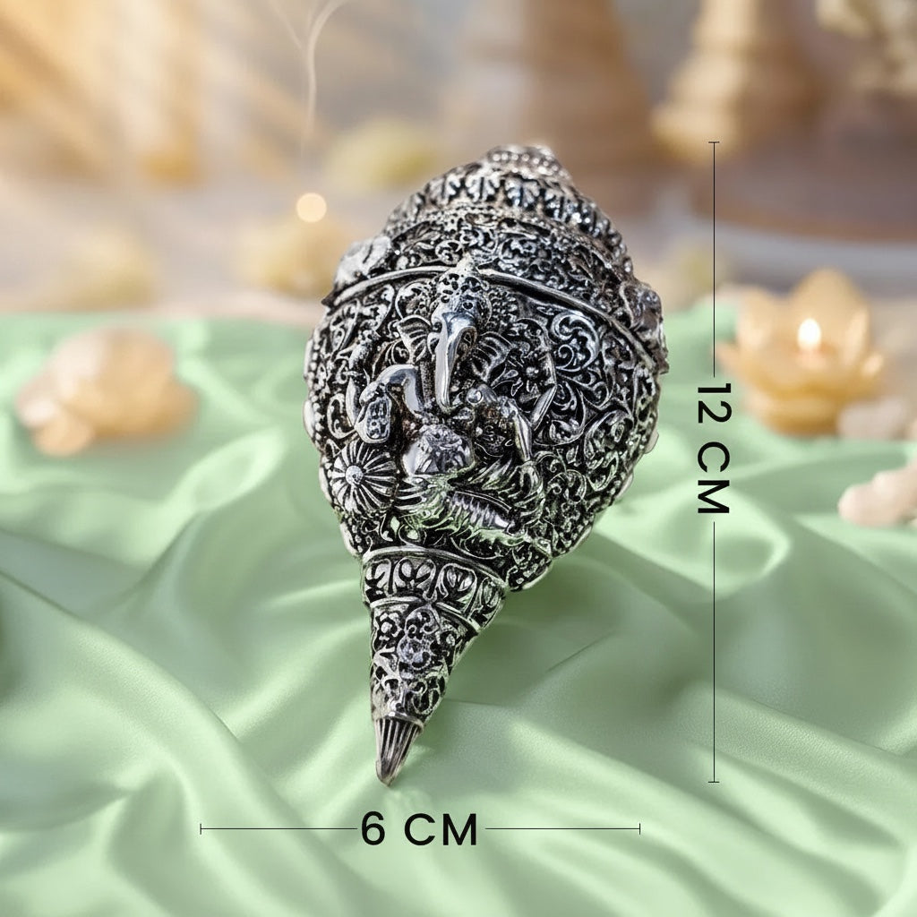 VASTUKOSHA silver-plated Ganesh Shankh conch shell with intricate embossed detailing for home puja and spiritual decor.