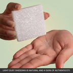 VASTUKOSHA square raw selenite plate held in hand showing natural translucent white crystal texture and surface shedding