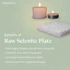 VASTUKOSHA square raw selenite plate for crystal cleansing and meditation, displayed with two lit candles.
