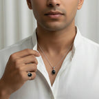 VASTUKOSHA Sulemani Hakik black agate pendant and ring set worn by a man in a white shirt for spiritual practice