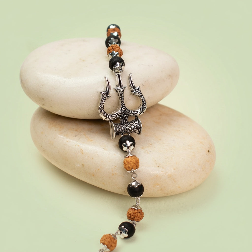 VASTUKOSHA Mahadev bracelet featuring a silver Trishul and Damru charm with 5 Mukhi Rudraksha and black Karungali beads.