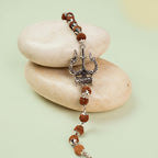 VASTUKOSHA Mahadev bracelet featuring 5 Mukhi Rudraksha beads and an oxidised silver Trishul charm on smooth stones.