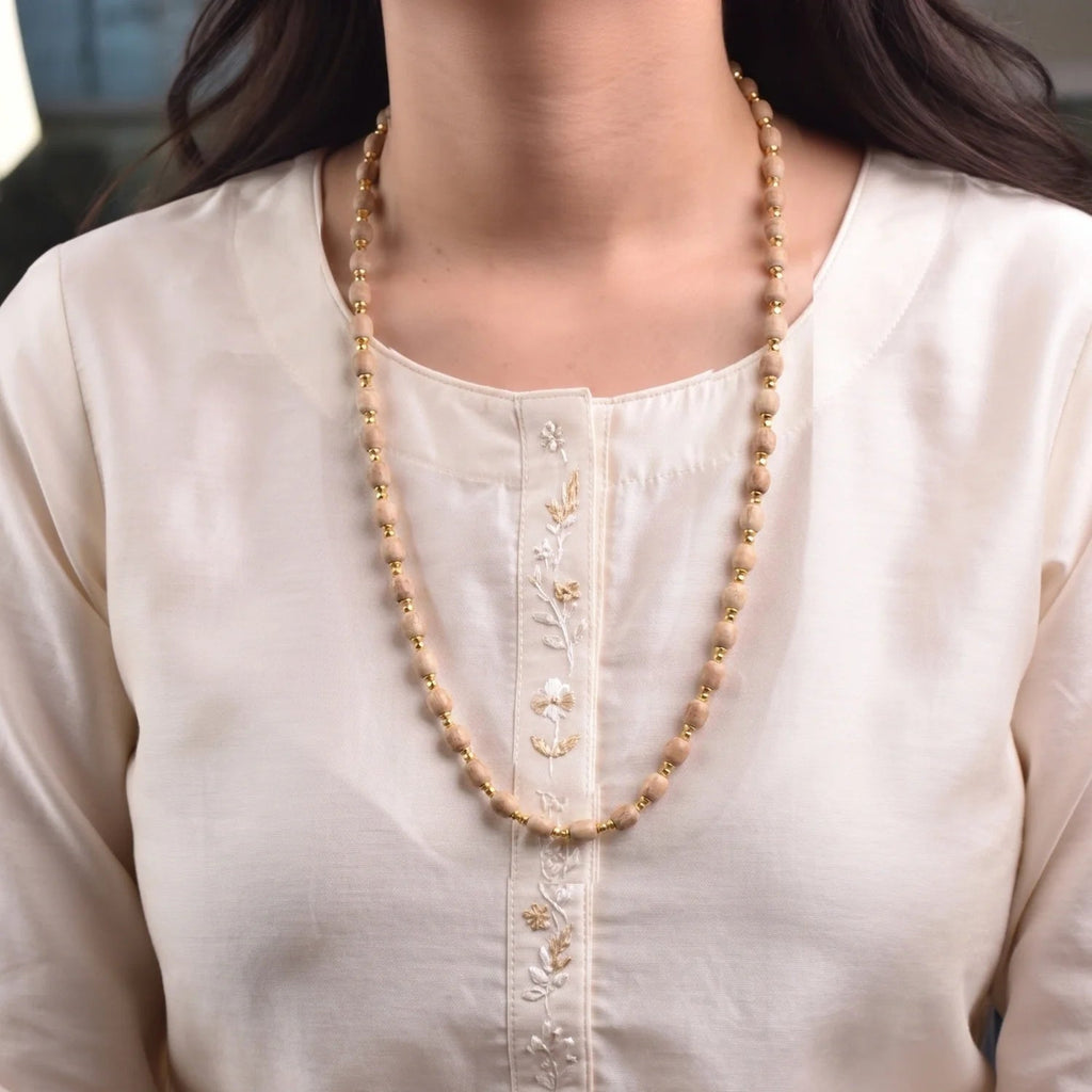 VASTUKOSHA Vishnu Tulsi Mala featuring natural wood beads with silver-plated anti-tarnish caps worn by a woman