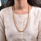 VASTUKOSHA Vishnu Tulsi Mala featuring natural wood beads with silver-plated anti-tarnish caps worn by a woman