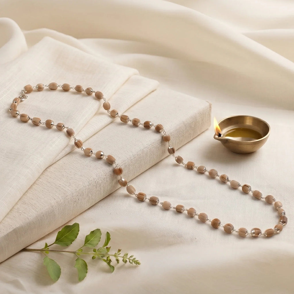 VASTUKOSHA Vishnu Tulsi Mala featuring natural wood beads with silver-plated anti-tarnish caps for spiritual practice.