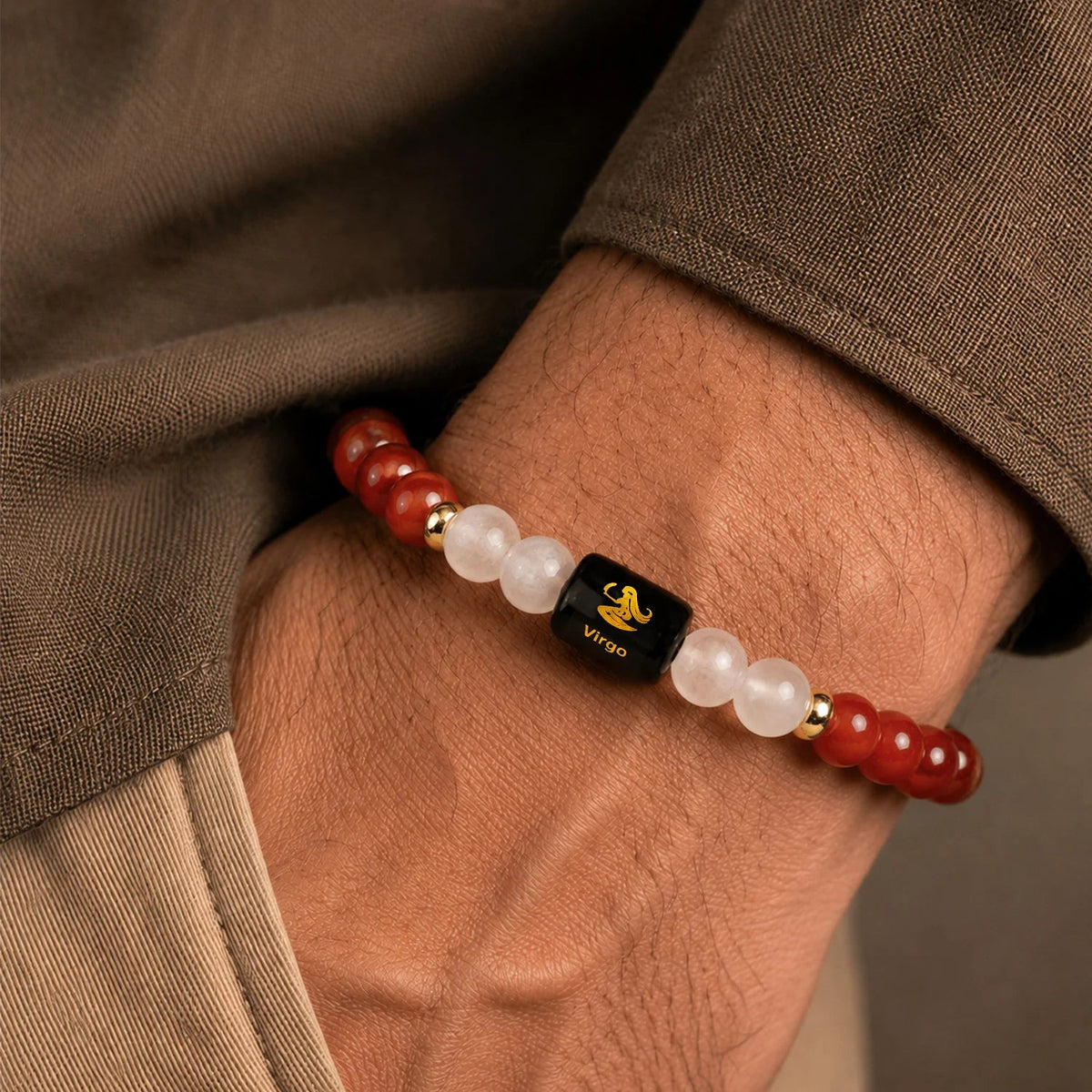 VASTUKOSHA Virgo zodiac bracelet featuring red carnelian and milky quartz beads with a central black Virgo symbol charm.