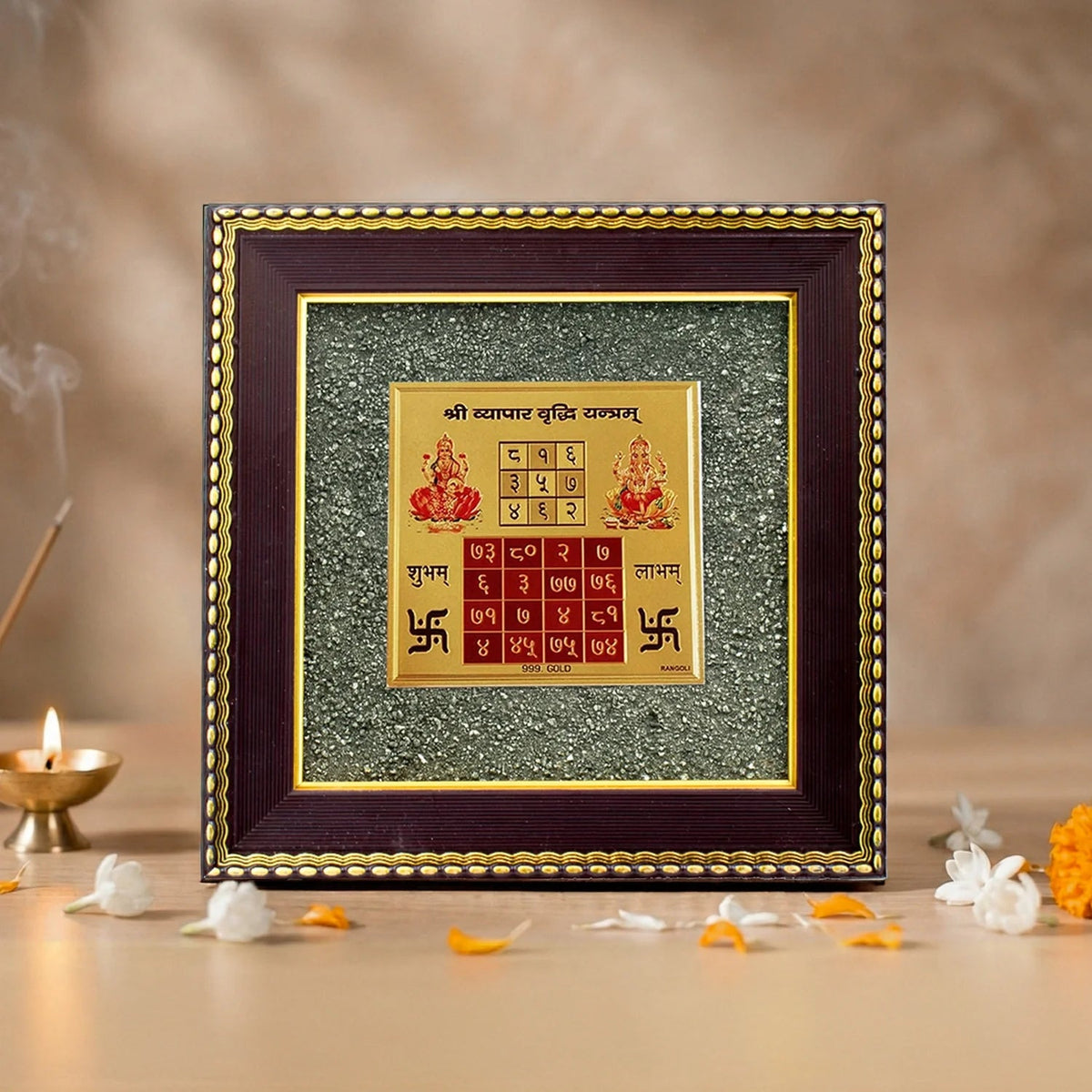 VASTUKOSHA Vyapar Vriddhi Yantra featuring a gold-toned square plate framed by textured raw pyrite for business growth.