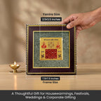 VASTUKOSHA Vyapar Vriddhi Yantra on a raw pyrite frame, held by hand, designed for business growth and prosperity.