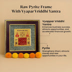 VASTUKOSHA Vyapar Vriddhi Yantra framed in raw pyrite for business growth and prosperity, decorated with marigold flowers.