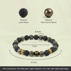 VASTUKOSHA Wealth OM bracelet featuring raw pyrite and black lava beads with a central Om symbol and gold-tone spacers.