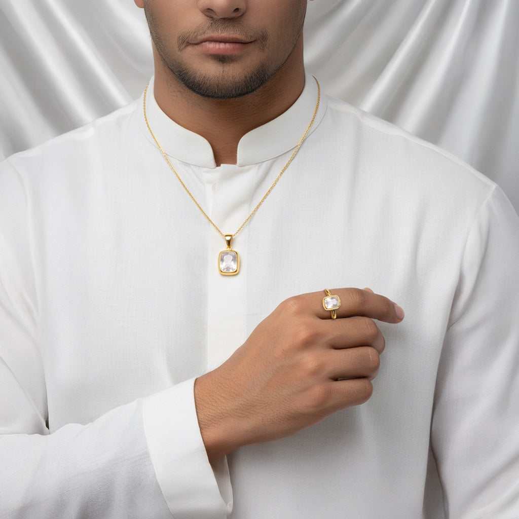 Man wearing a VASTUKOSHA white pukhraj gemstone pendant and matching ring in gold settings with a white kurta