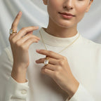 VASTUKOSHA white topaz ring and pendant set worn by a model in a white top, showcasing elegant spiritual jewelry.